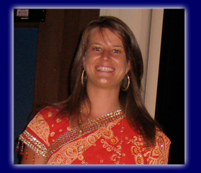 Liz Monteith in an orange Indian sari